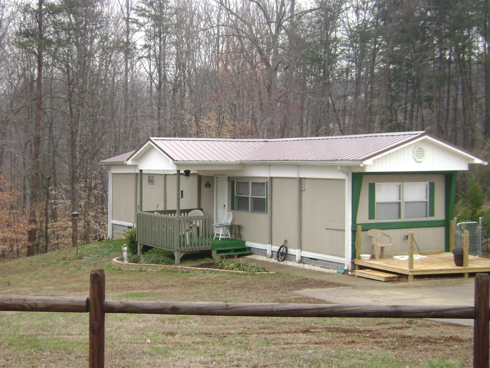 Mauve metal roof on a manufactured home with a new front deck in Athens